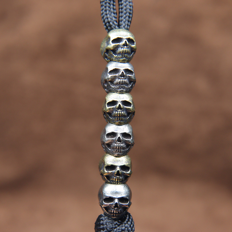 Mini Skull Head Brass Knife Be - огляд і ціна Paracord Survival Bracelet