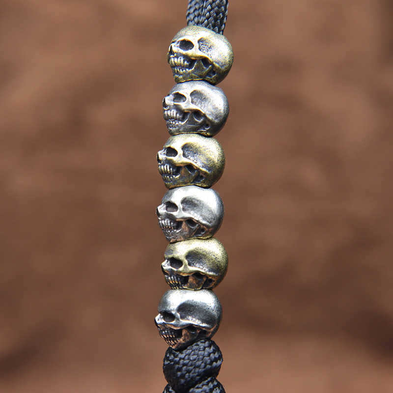 Mini Skull Head Brass Knife Be - огляд і ціна Paracord Survival Bracelet