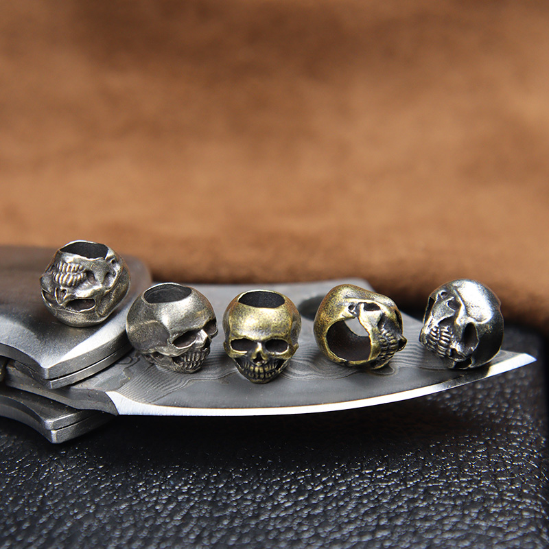 Mini Skull Head Brass Knife Be - огляд і ціна Paracord Survival Bracelet